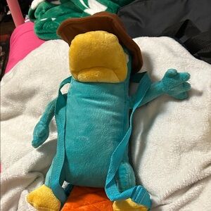 Teal and Yellow Plush Backpack with Brown Hat